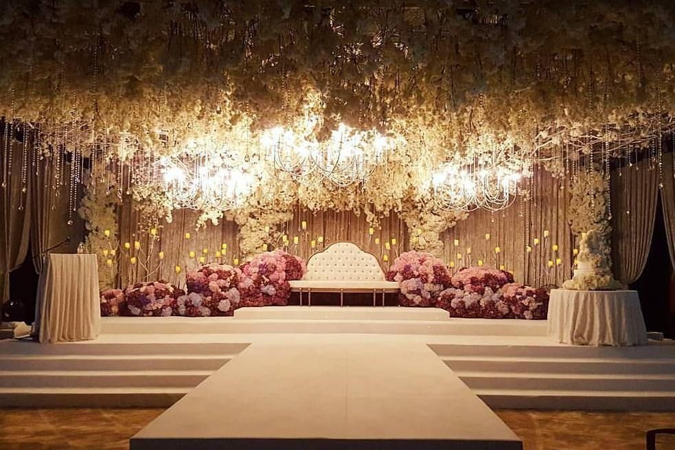 Outdoor event with yellow floral and marigold decorations